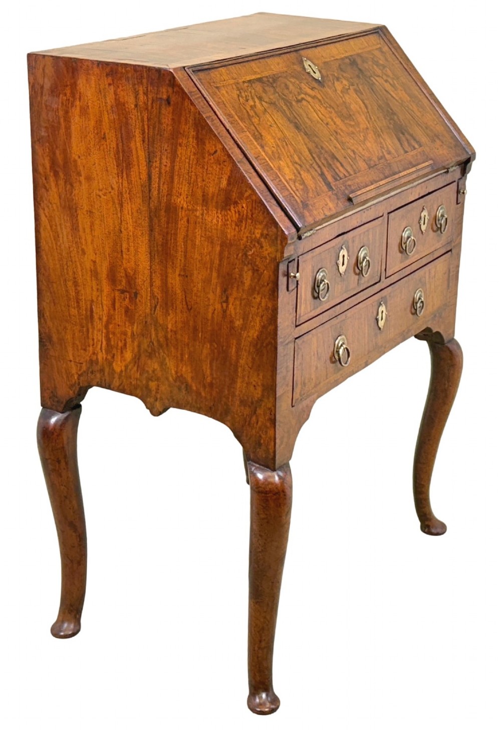 An early 18th-century walnut bureau on legs featuring a slant-front lid, small drawers with brass teardrop handles, and cabriole legs. View IV