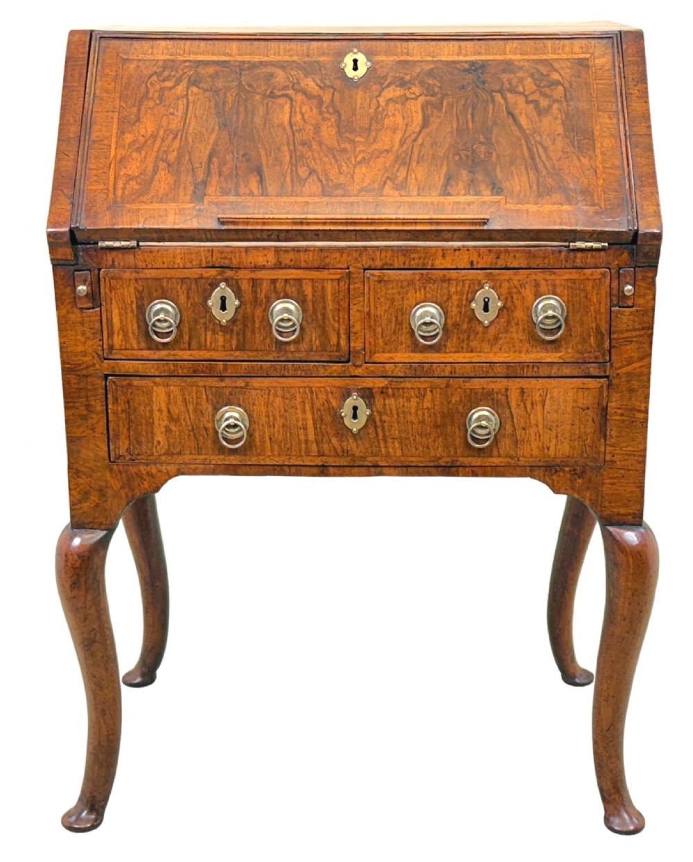 An early 18th-century walnut bureau on legs featuring a slant-front lid, small drawers with brass teardrop handles, and cabriole legs. View XV