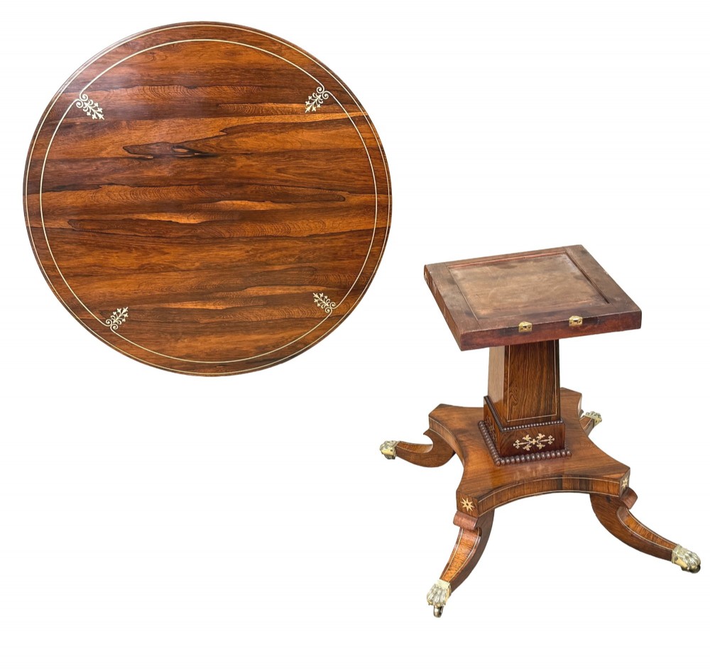 A circular Regency rosewood centre table featuring brass inlay motifs around the rim, a central pedestal support, and a quadform base with splayed legs ending in brass paw castors. View VIII