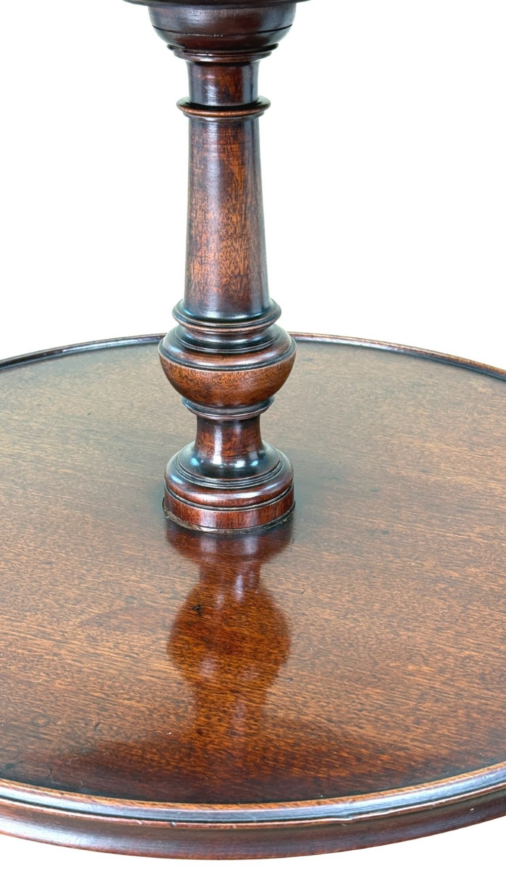 An 18th-century Georgian mahogany dumbwaiter featuring three graduated circular dished tiers supported by a turned central column and a tripod base with pad feet. View III
