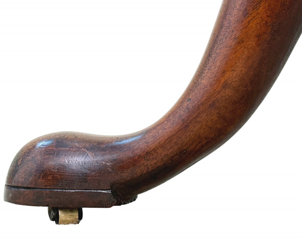 An 18th-century Georgian mahogany dumbwaiter featuring three graduated circular dished tiers supported by a turned central column and a tripod base with pad feet. View VI