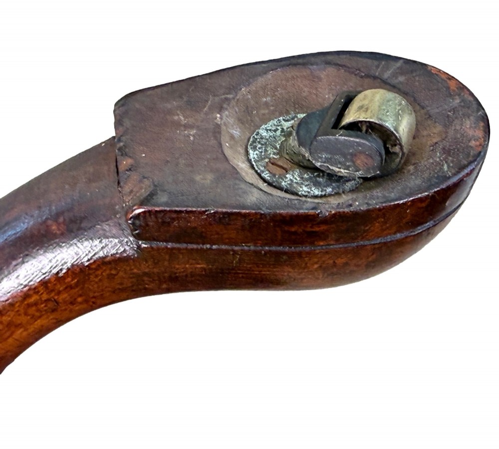 An 18th-century Georgian mahogany dumbwaiter featuring three graduated circular dished tiers supported by a turned central column and a tripod base with pad feet. View X