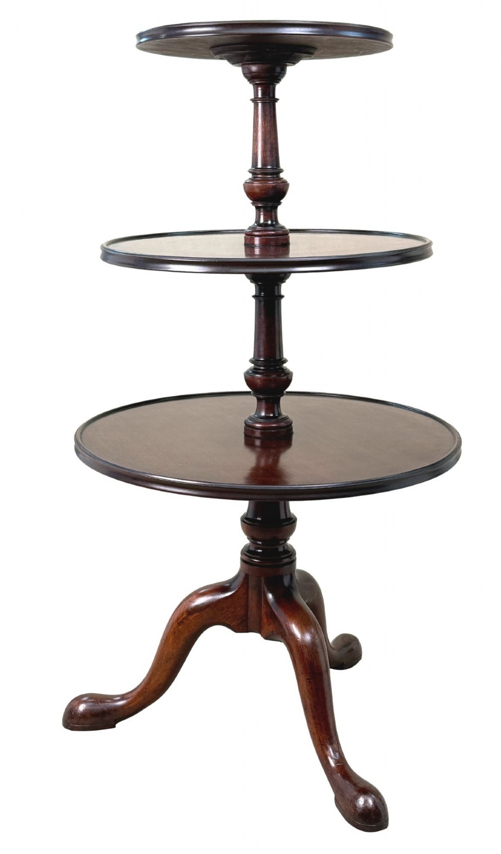 An 18th-century Georgian mahogany dumbwaiter featuring three graduated circular dished tiers supported by a turned central column and a tripod base with pad feet. View XII