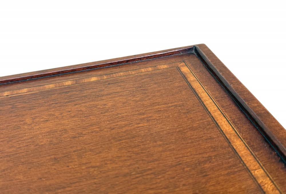 A 19th-century set of four graduated mahogany nesting tables featuring slender turned spindle legs and sledge feet. View XII