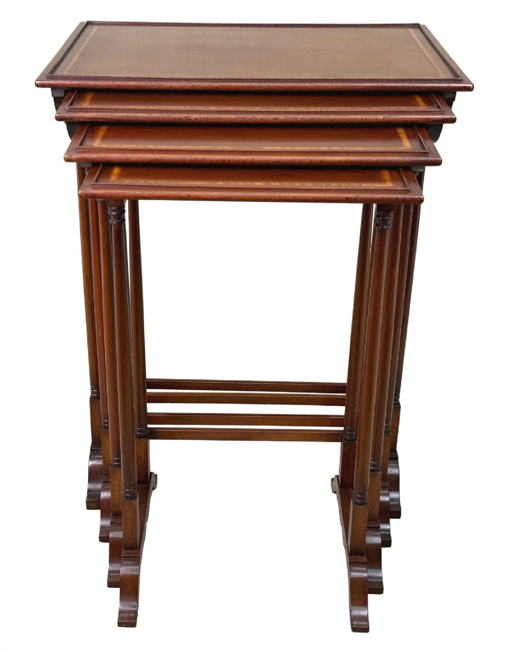 A 19th-century set of four graduated mahogany nesting tables featuring slender turned spindle legs and sledge feet. View XIV