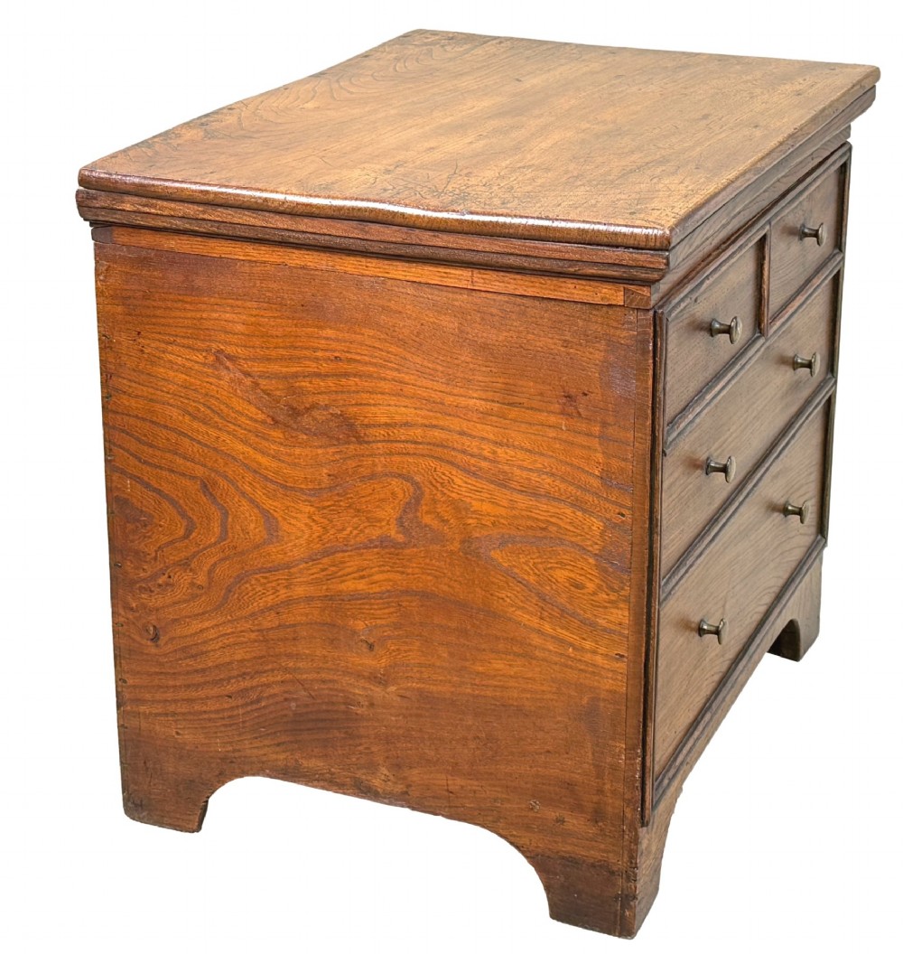 An 18th-century warm brown elm close stool designed as a small Georgian chest of drawers with bracket feet and brass handles. View VII