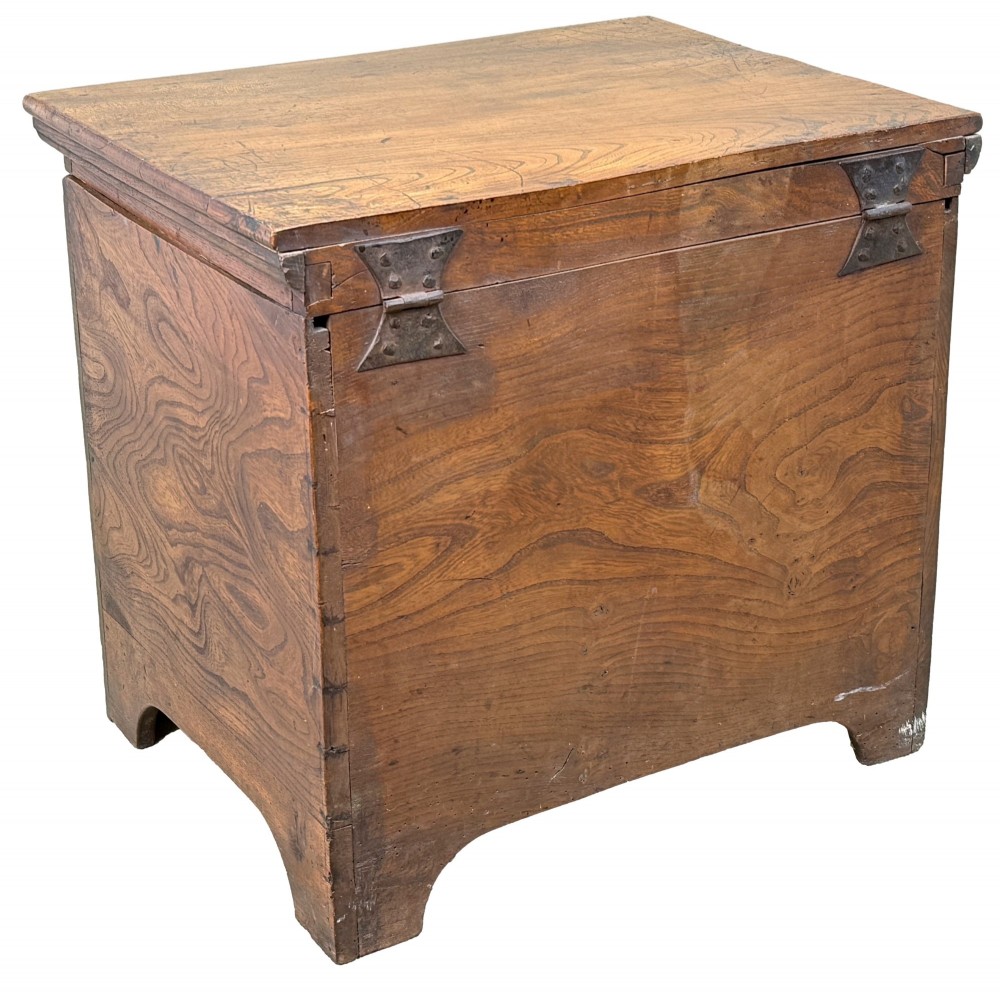 An 18th-century warm brown elm close stool designed as a small Georgian chest of drawers with bracket feet and brass handles. View IX