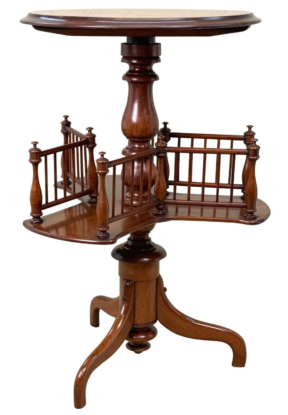 A 19th-century Victorian burr walnut circular occasional table with a central turned column, three-section spindle gallery tier, and a tripod base.