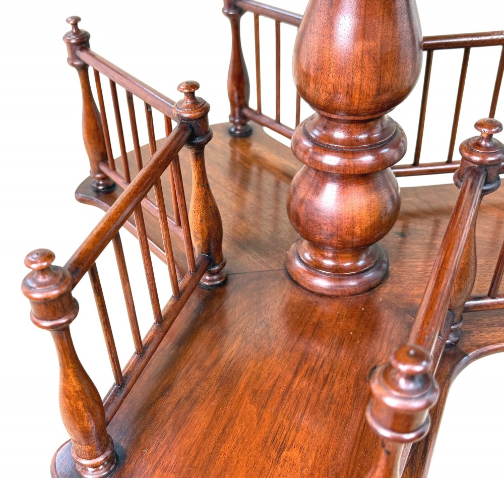 A 19th-century Victorian burr walnut circular occasional table with a central turned column, three-section spindle gallery tier, and a tripod base. View V
