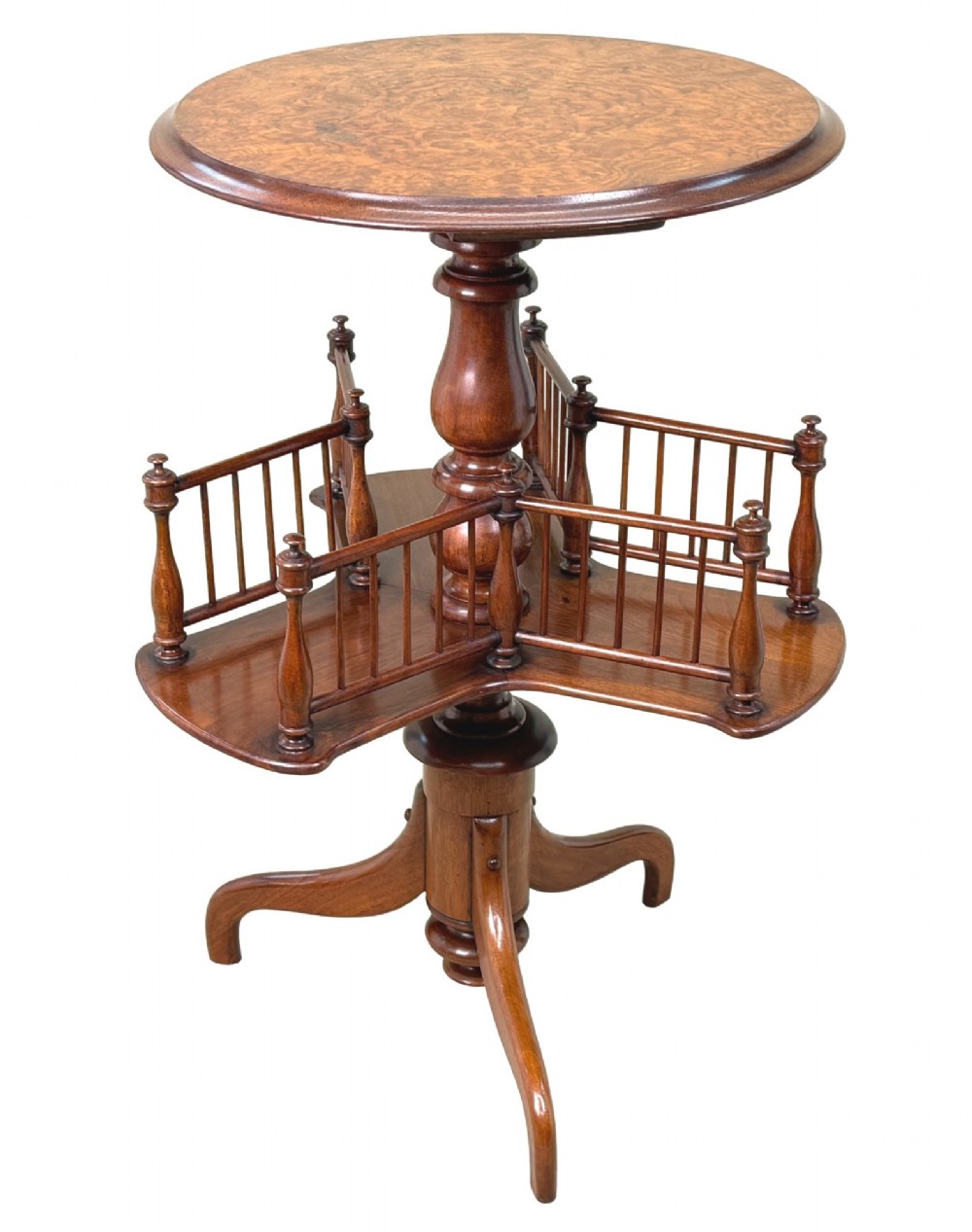 A 19th-century Victorian burr walnut circular occasional table with a central turned column, three-section spindle gallery tier, and a tripod base. View VII