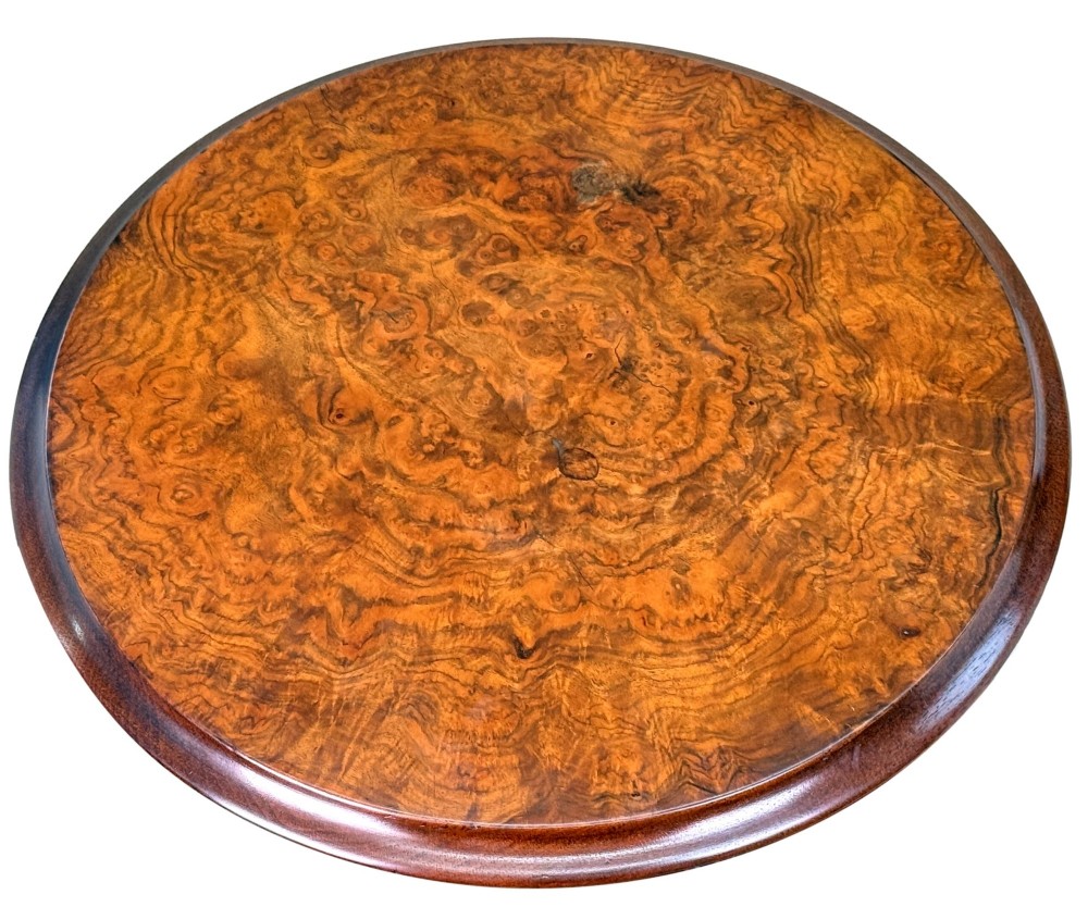 A 19th-century Victorian burr walnut circular occasional table with a central turned column, three-section spindle gallery tier, and a tripod base. View X