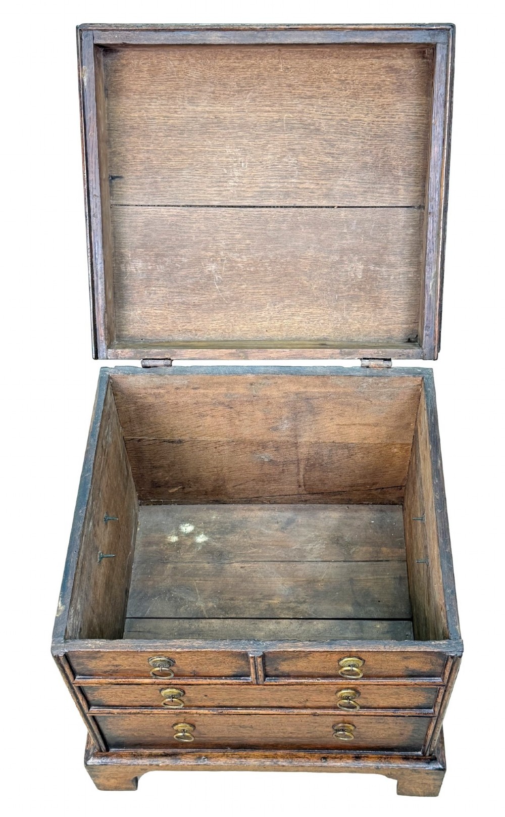 An 18th-century dark oak close stool designed as a small chest with faux drawer fronts, brass ring handles, and bracket feet. View VIII