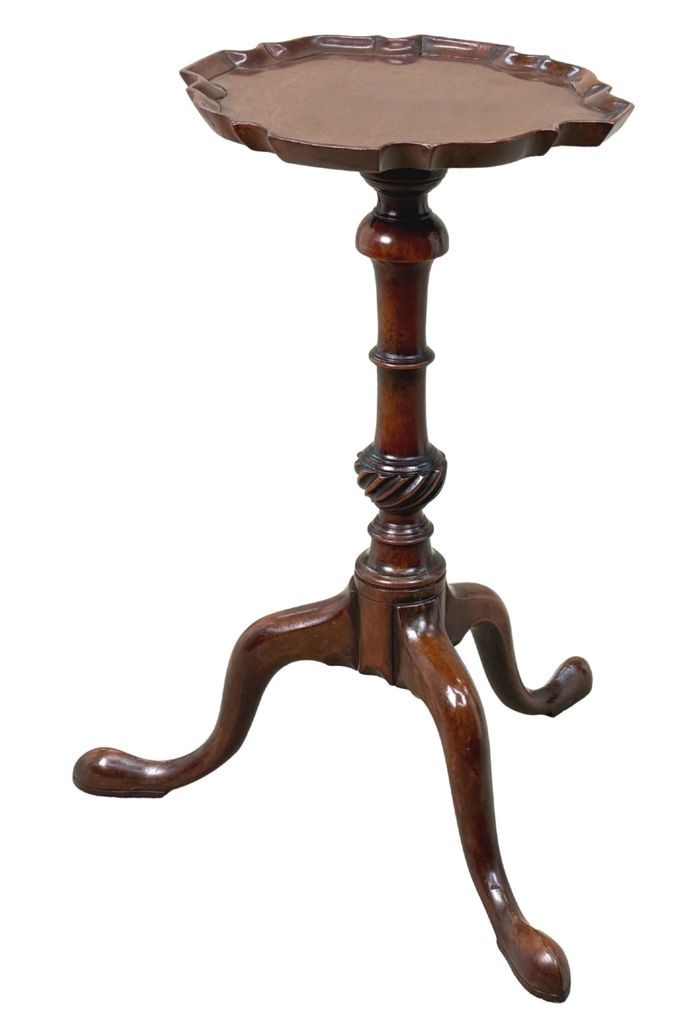 An 18th-century mahogany kettle stand with a raised piecrust top on a turned pedestal column and tripod base. View VI