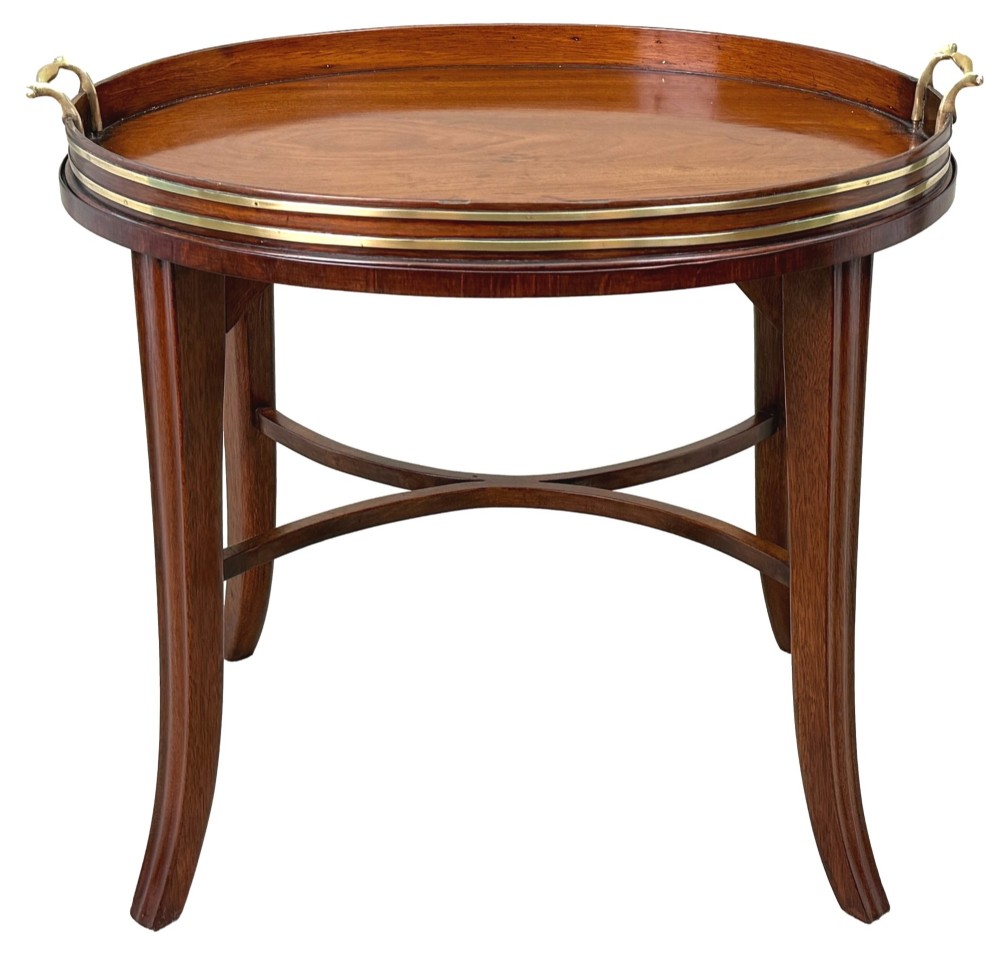 A Georgian mahogany oval tray table featuring a double brass-bound gallery rim, twin side handles, and four splayed legs joined by an X-frame stretcher. View IX