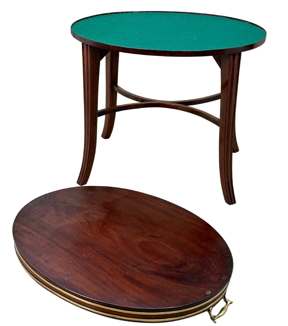 A Georgian mahogany oval tray table featuring a double brass-bound gallery rim, twin side handles, and four splayed legs joined by an X-frame stretcher. View XI