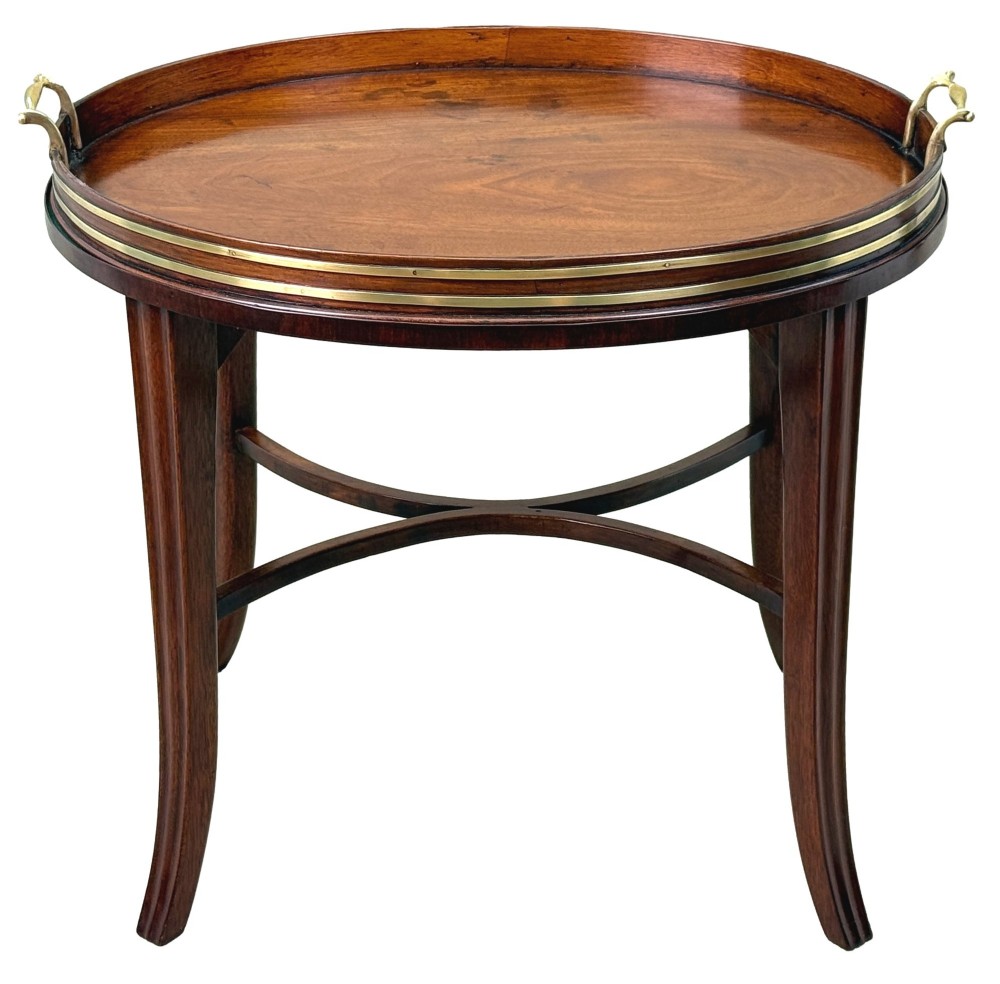 A Georgian mahogany oval tray table featuring a double brass-bound gallery rim, twin side handles, and four splayed legs joined by an X-frame stretcher. View XII
