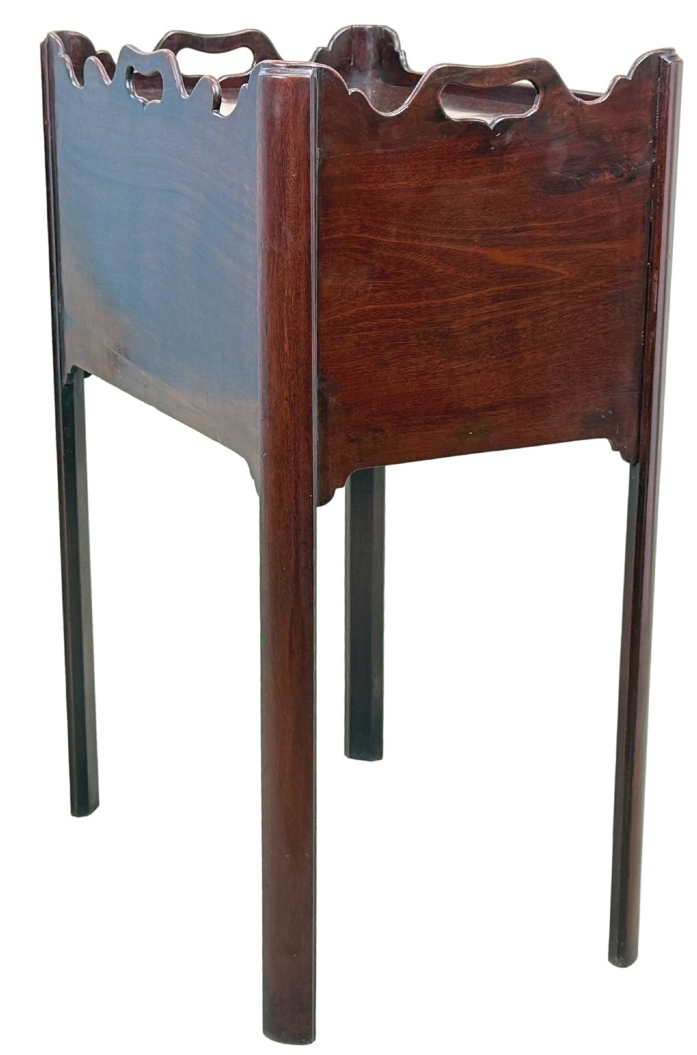 An 18th-century Georgian mahogany bedside table with a wavy gallery top featuring pierced hand cutouts, an open shelf compartment, and four square legs. View V