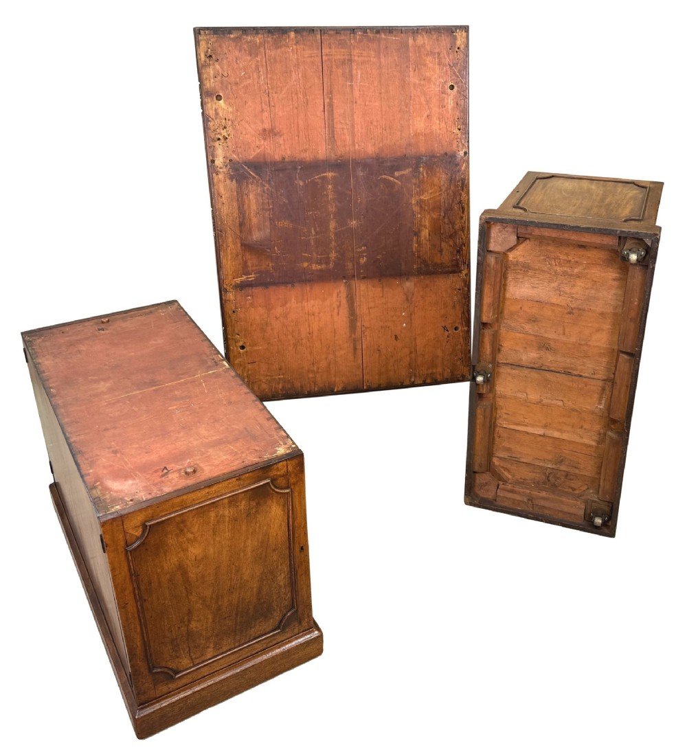 An 18th-century Georgian mahogany partners desk featuring three top frieze drawers and twin pedestal cupboards set on a plinth base. View XIII