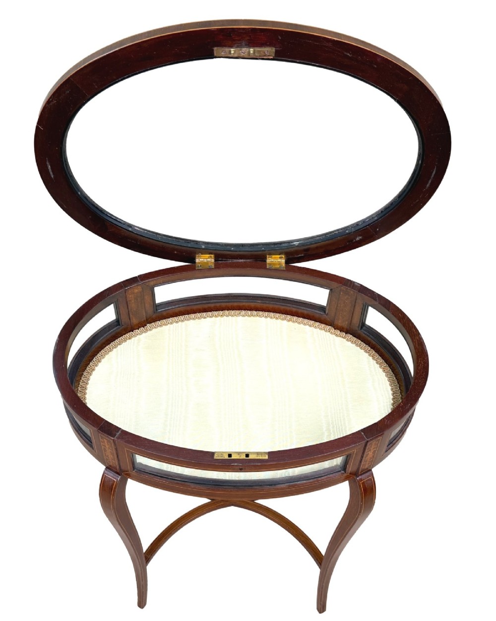 An oval late 19th-century mahogany bijouterie display table featuring glass side panels, inlaid floral marquetry, slender cabriole legs, and a cross stretcher. View II