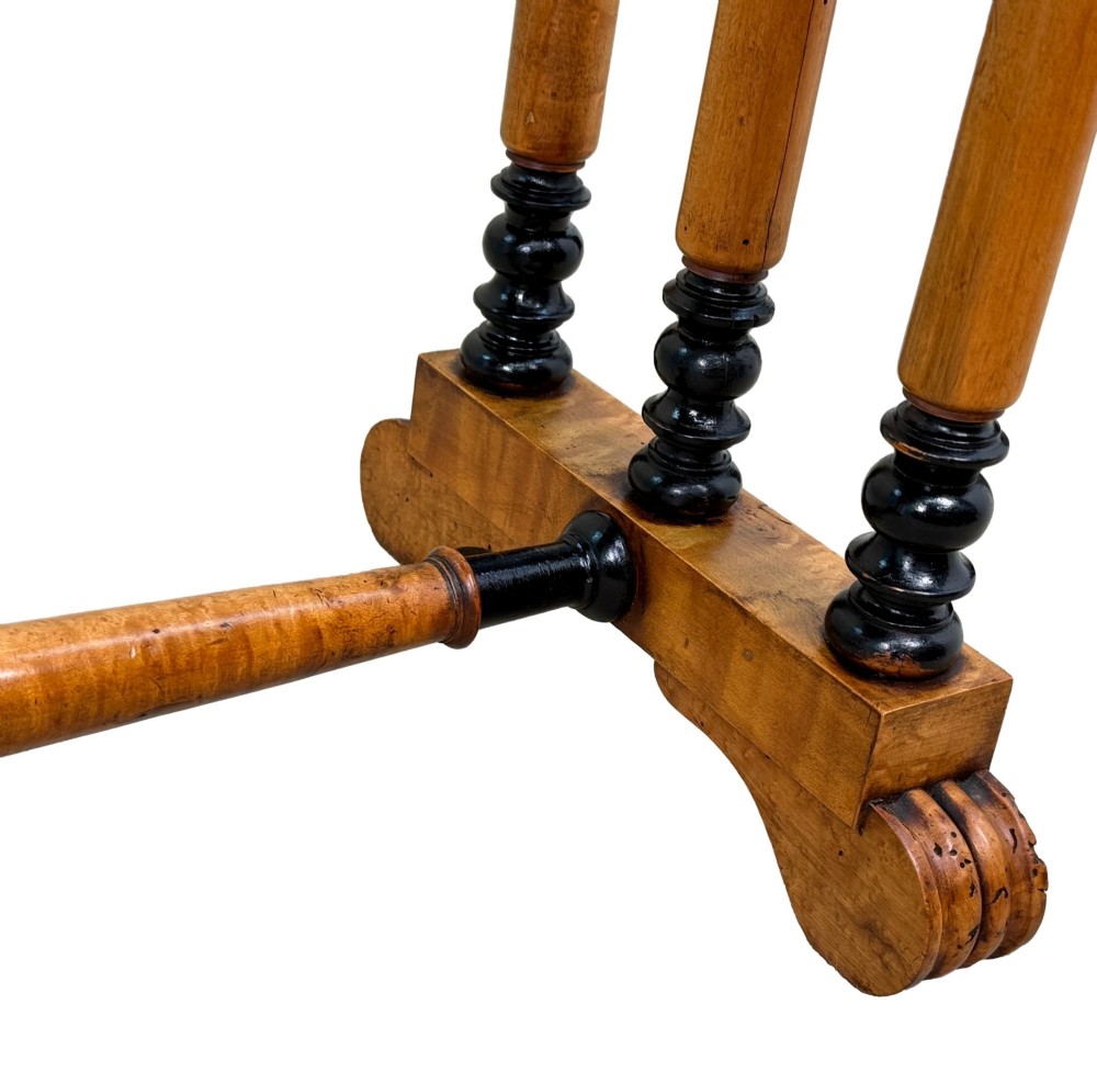 A pair of Regency birdseye maple occasional tables featuring quadrupled slender turned legs with ebonised details and a stretcher base. View VIII