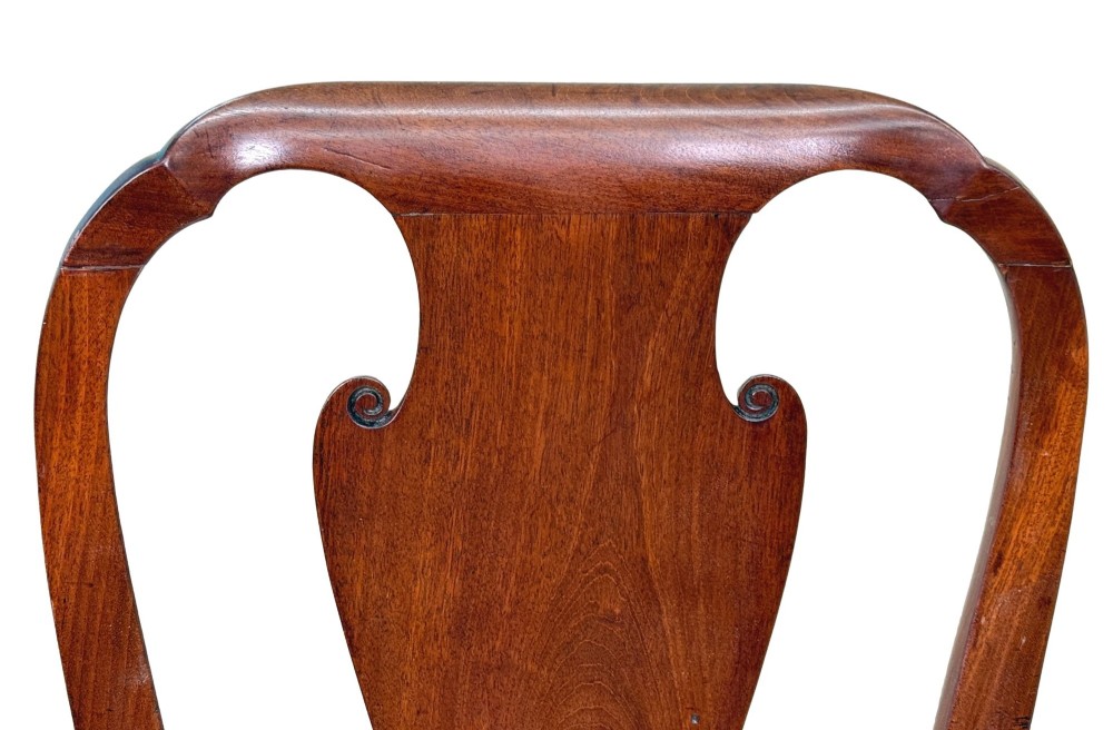 A pair of early 18th-century Queen Anne walnut side chairs featuring vase-shaped back splats, curved cabriole front legs, and cream upholstered drop-in seats. View III