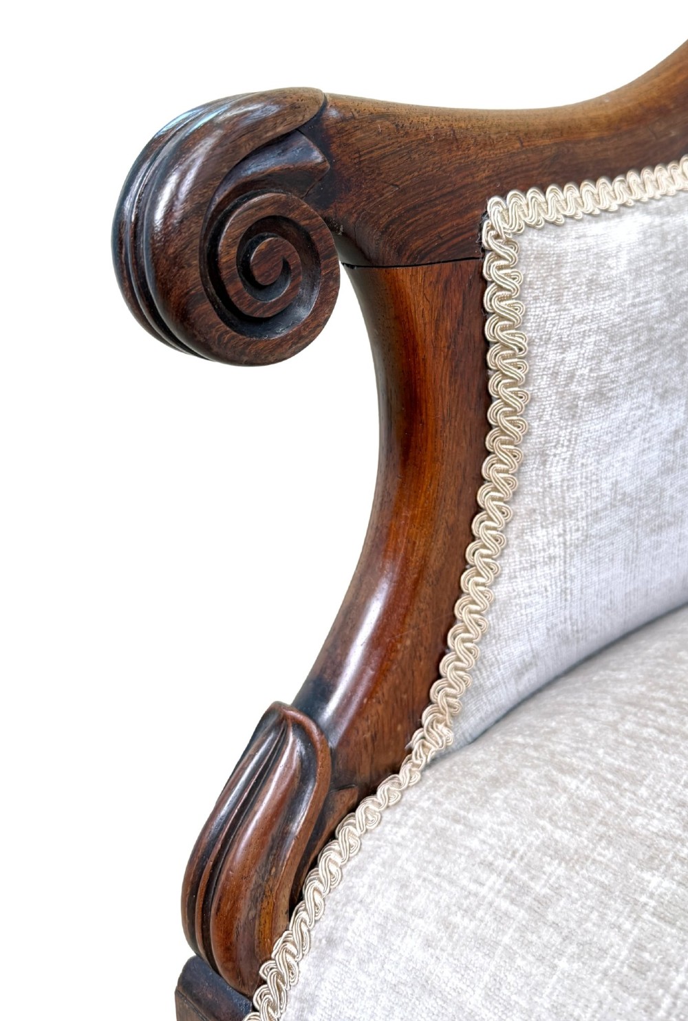 A 19th-century Regency period rosewood tub library armchair upholstered in cream fabric with turned legs and brass castors. View IV
