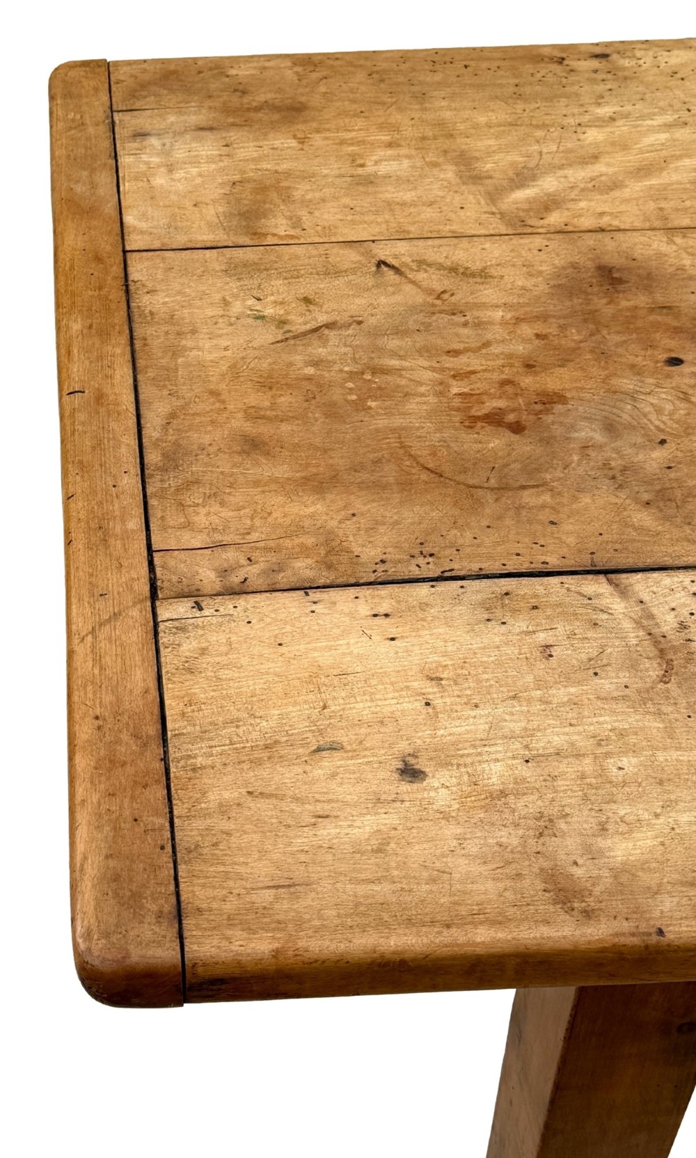 An early 19th-century French Provincial sycamore farmhouse dining table featuring a light wood plank top and tapered square legs. View VIII