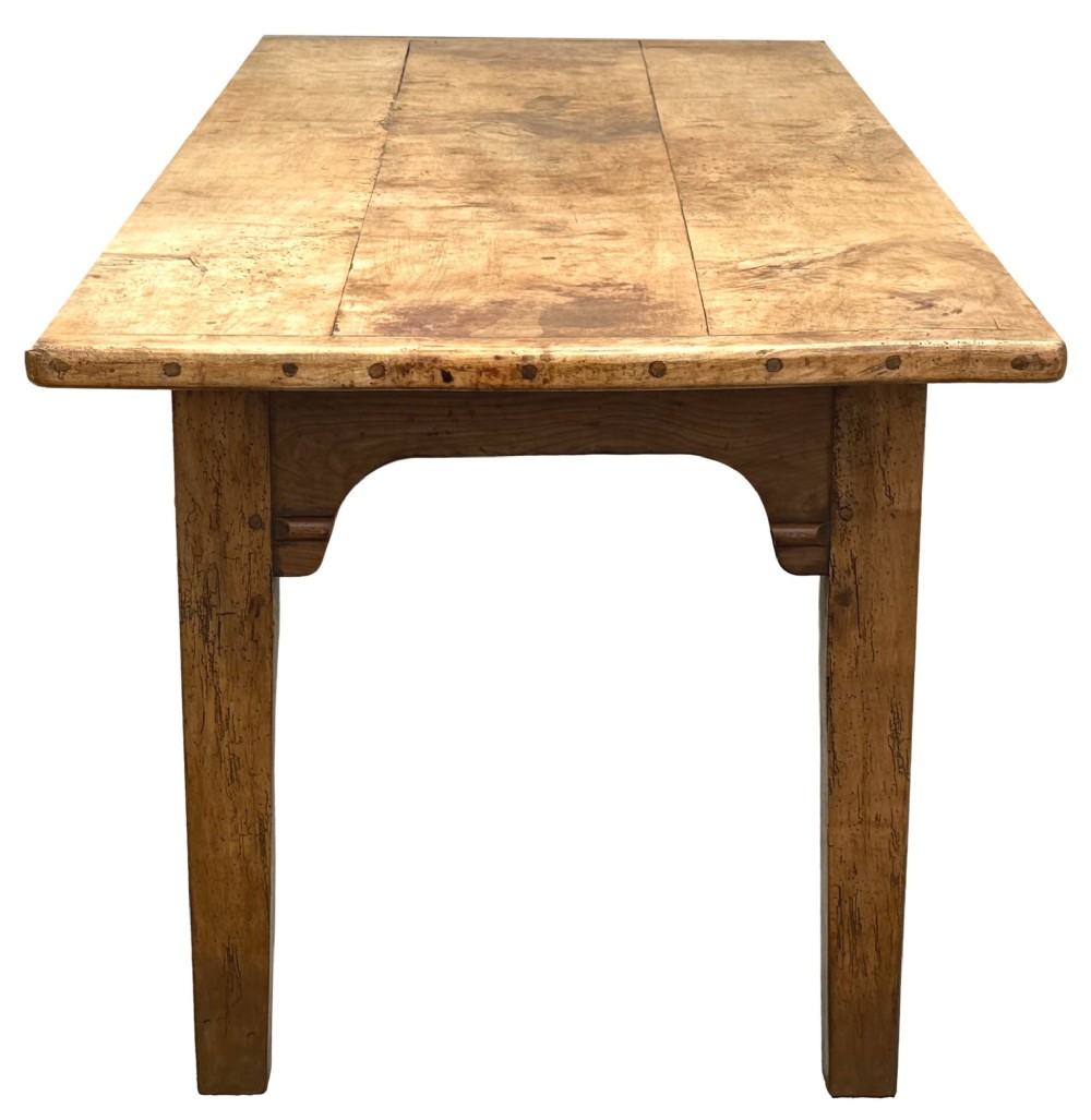 An early 19th-century French Provincial sycamore farmhouse dining table featuring a light wood plank top and tapered square legs. View IX