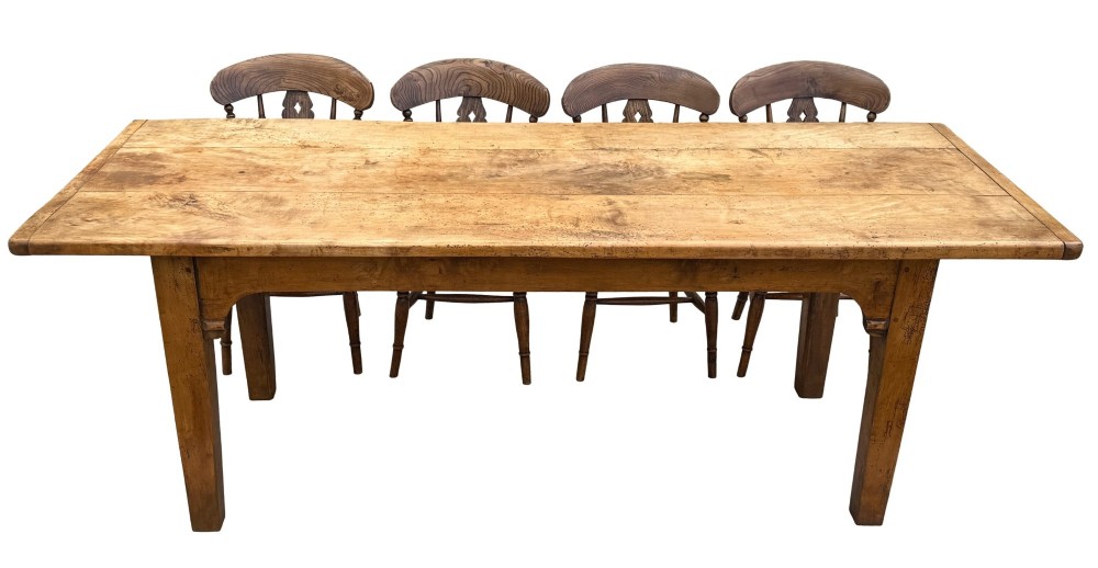 An early 19th-century French Provincial sycamore farmhouse dining table featuring a light wood plank top and tapered square legs. View XI