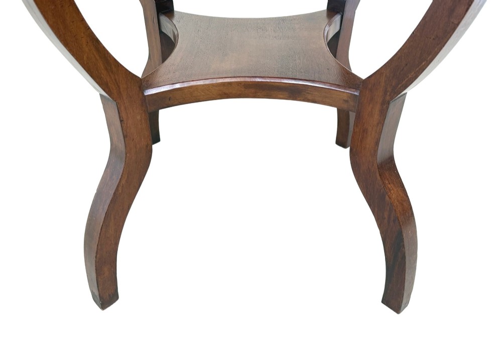 A late nineteenth-century circular mahogany occasional table featuring a specimen marble top, outcurving legs with gilt mounts, and a lower undertier. View VI