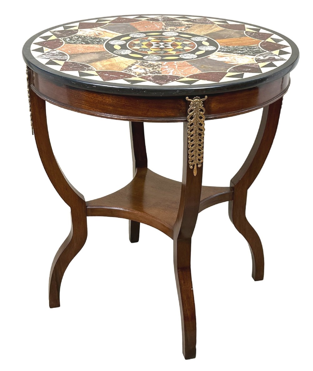 A late nineteenth-century circular mahogany occasional table featuring a specimen marble top, outcurving legs with gilt mounts, and a lower undertier. View VIII