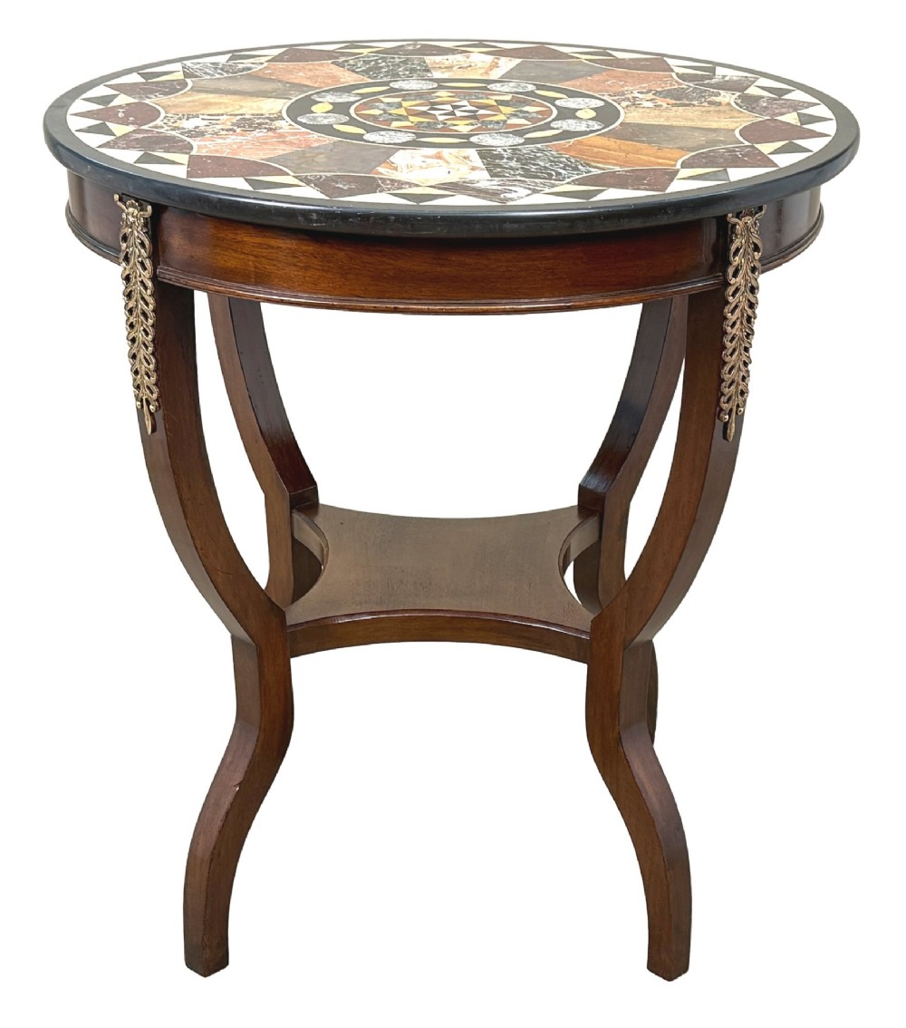 A late nineteenth-century circular mahogany occasional table featuring a specimen marble top, outcurving legs with gilt mounts, and a lower undertier. View XII