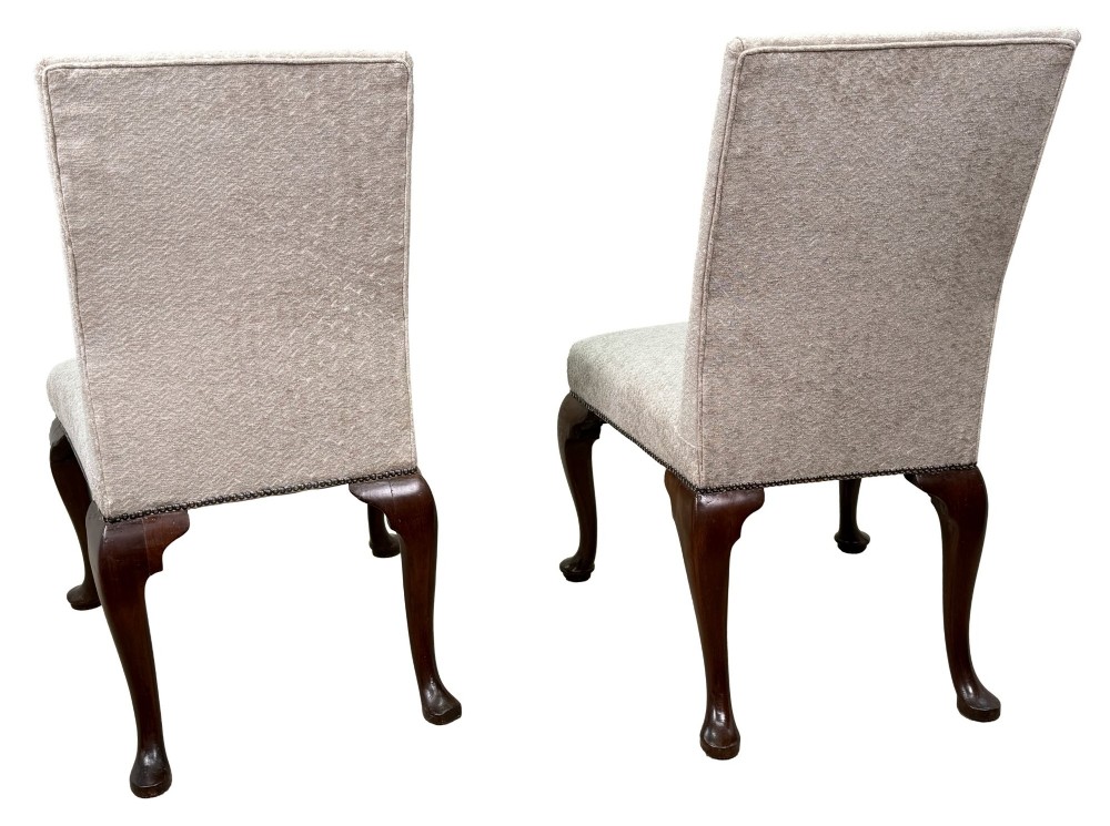 A pair of Georgian walnut side chairs featuring cream textured upholstery and carved cabriole legs ending in pad feet. View IV