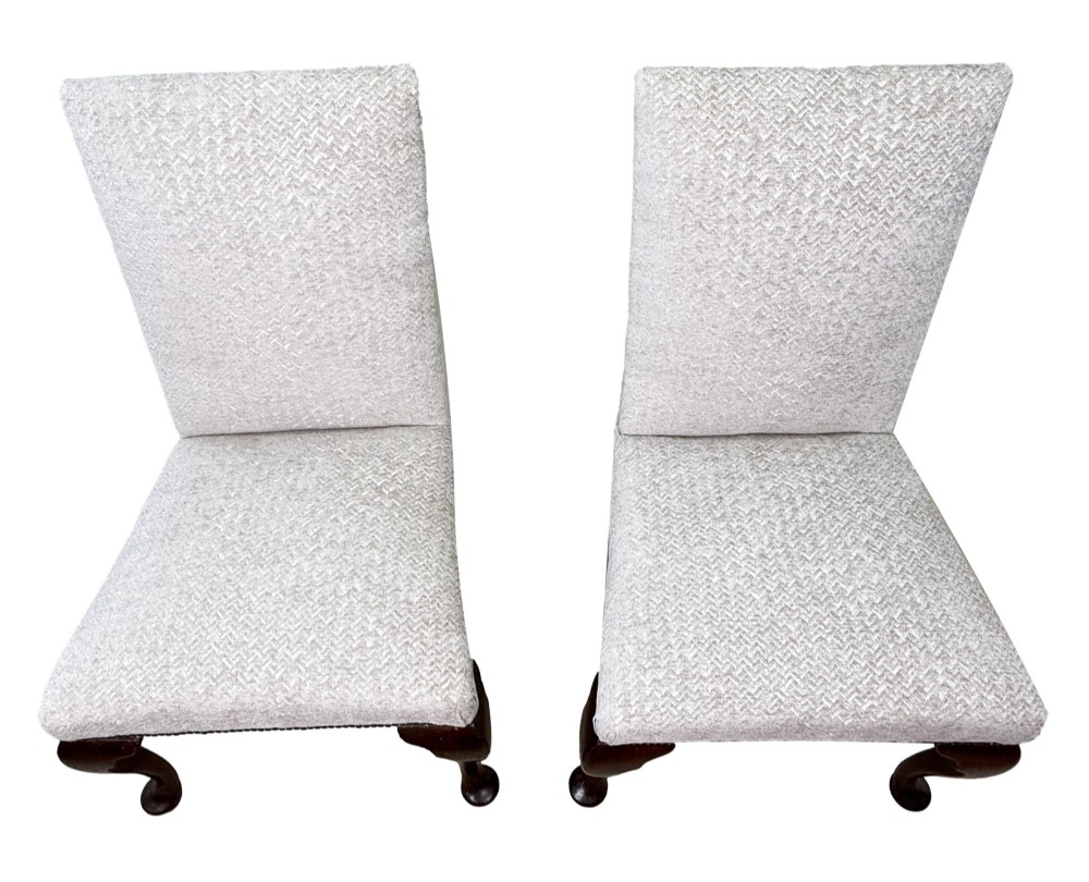 A pair of Georgian walnut side chairs featuring cream textured upholstery and carved cabriole legs ending in pad feet. View VII