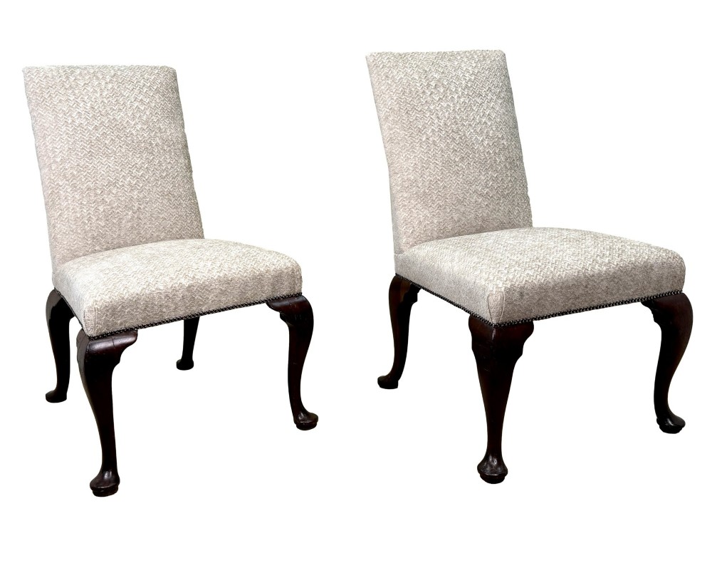 A pair of Georgian walnut side chairs featuring cream textured upholstery and carved cabriole legs ending in pad feet. View VIII