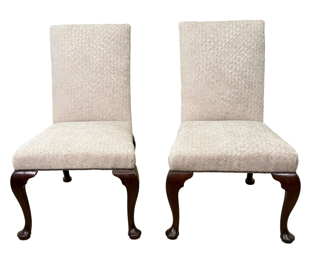 A pair of Georgian walnut side chairs featuring cream textured upholstery and carved cabriole legs ending in pad feet. View XIII