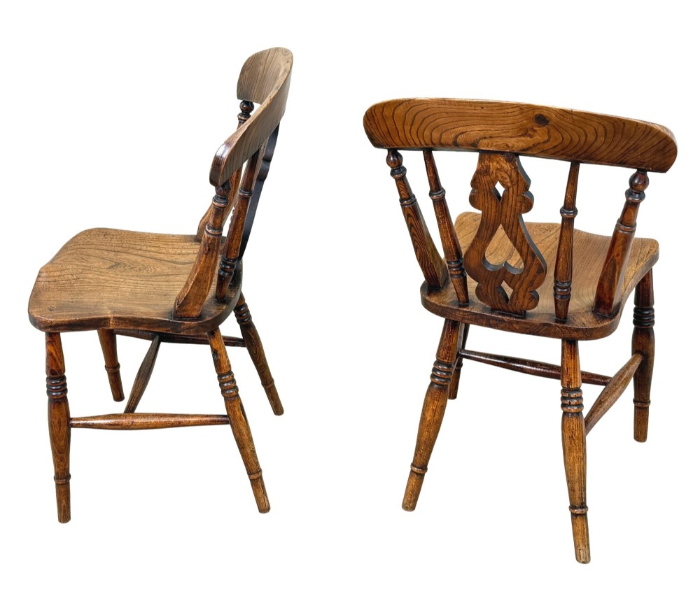 A set of six Victorian wooden Windsor dining chairs featuring shaped crest rails, pierced back splats, contoured saddle seats, and turned legs. View XI