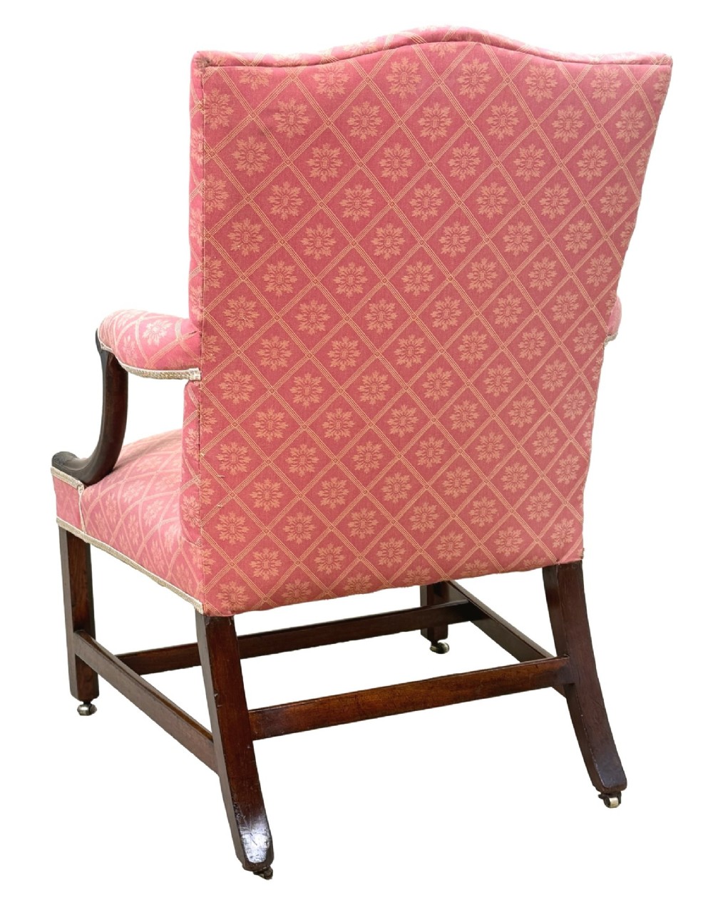 An 18th-century Georgian mahogany Gainsborough armchair with red patterned upholstery, curved carved arm supports, an H-stretcher frame, and brass castors. View IV