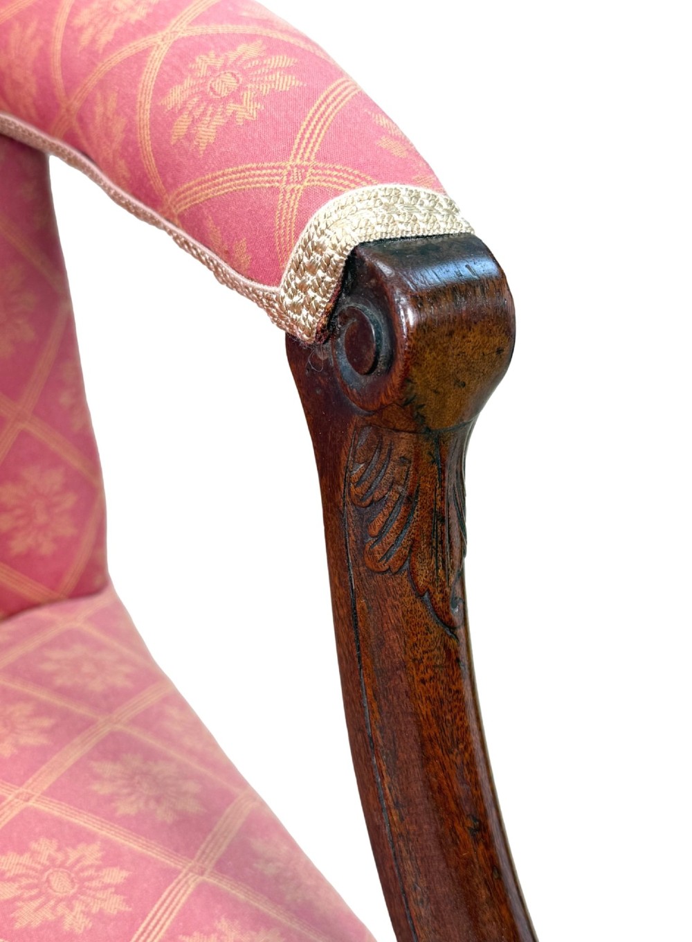 An 18th-century Georgian mahogany Gainsborough armchair with red patterned upholstery, curved carved arm supports, an H-stretcher frame, and brass castors. View VIII