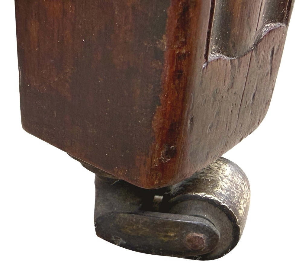 An 18th-century Georgian mahogany Gainsborough armchair with red patterned upholstery, curved carved arm supports, an H-stretcher frame, and brass castors. View XI