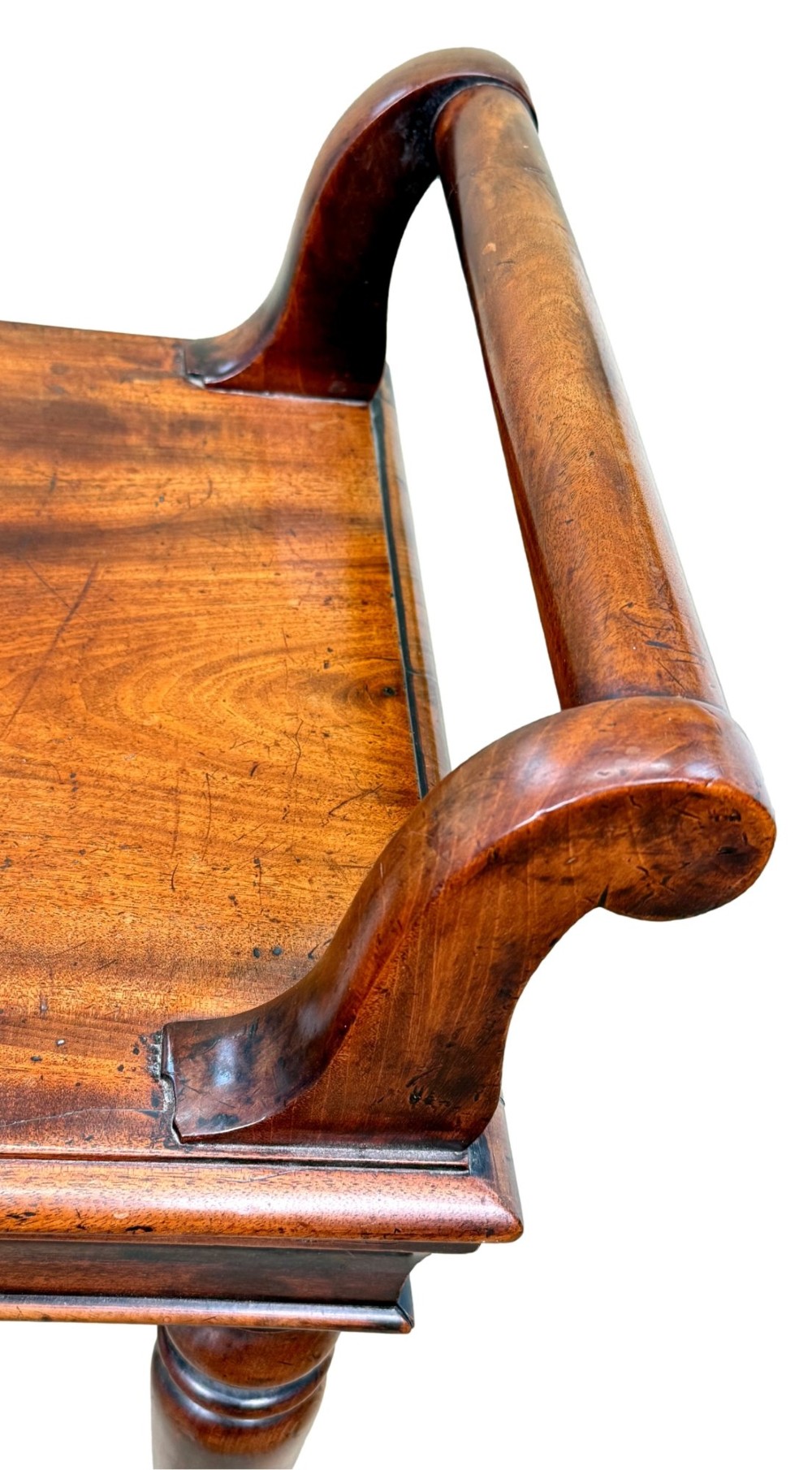 A mid-19th-century mahogany window seat with turned legs, a flat wooden seat, and curved end handles. View VII
