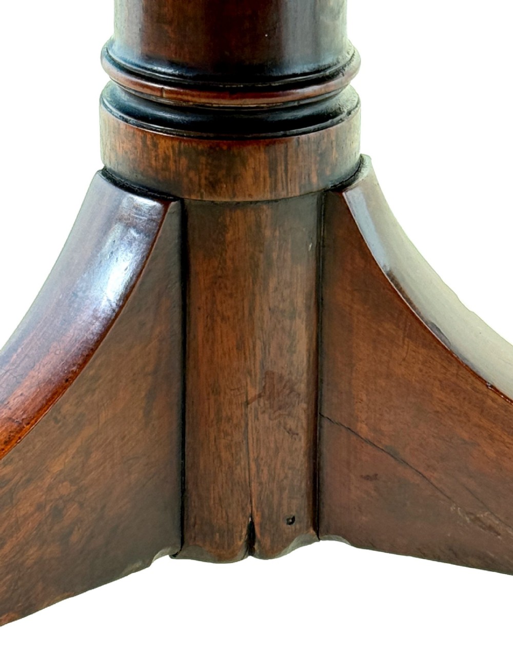 An 18th-century Georgian mahogany octagonal centre table with inlaid crossbanding, a central pedestal column, and tripod legs on brass castors. View VIII