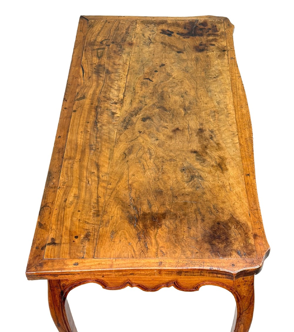 A late 18th-century French Provincial cherry wood side table featuring cabriole legs, a scalloped apron, and a single drawer with a brass escutcheon. View III