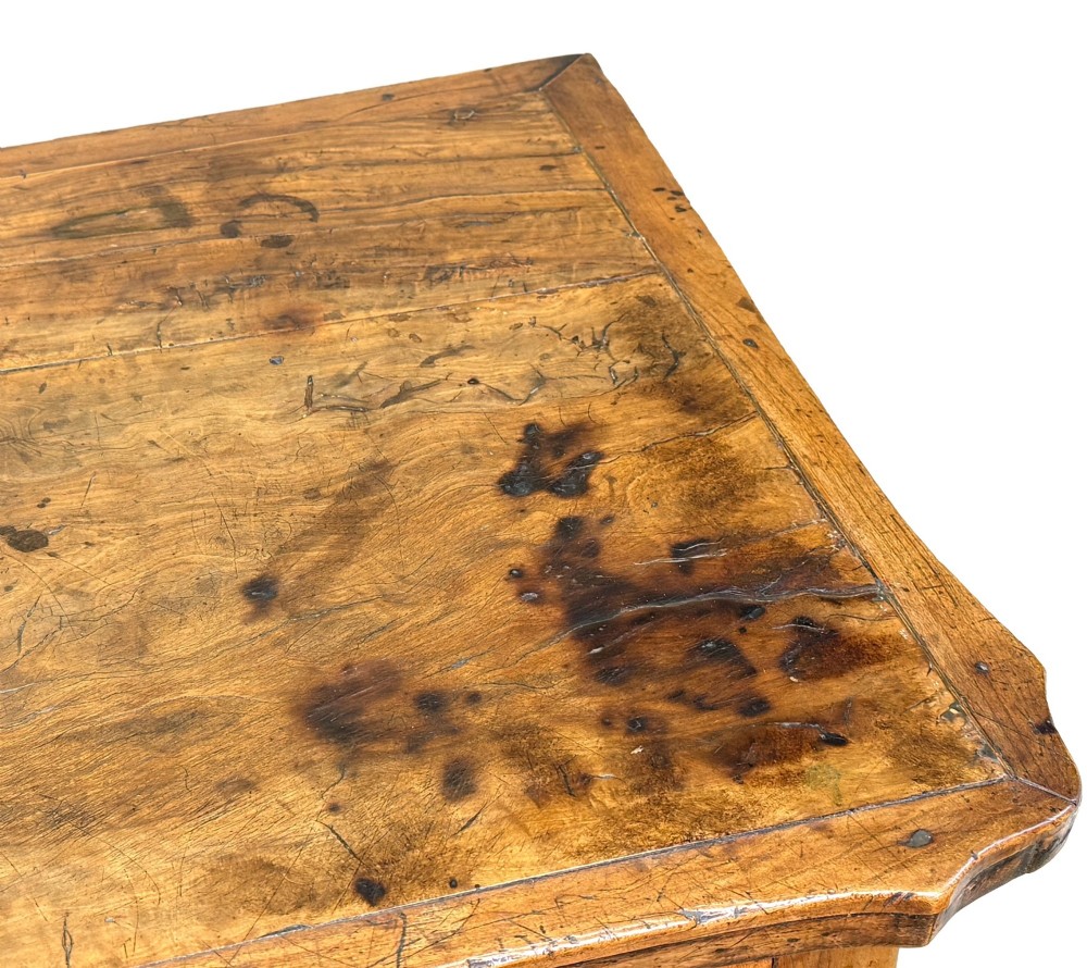 A late 18th-century French Provincial cherry wood side table featuring cabriole legs, a scalloped apron, and a single drawer with a brass escutcheon. View IV