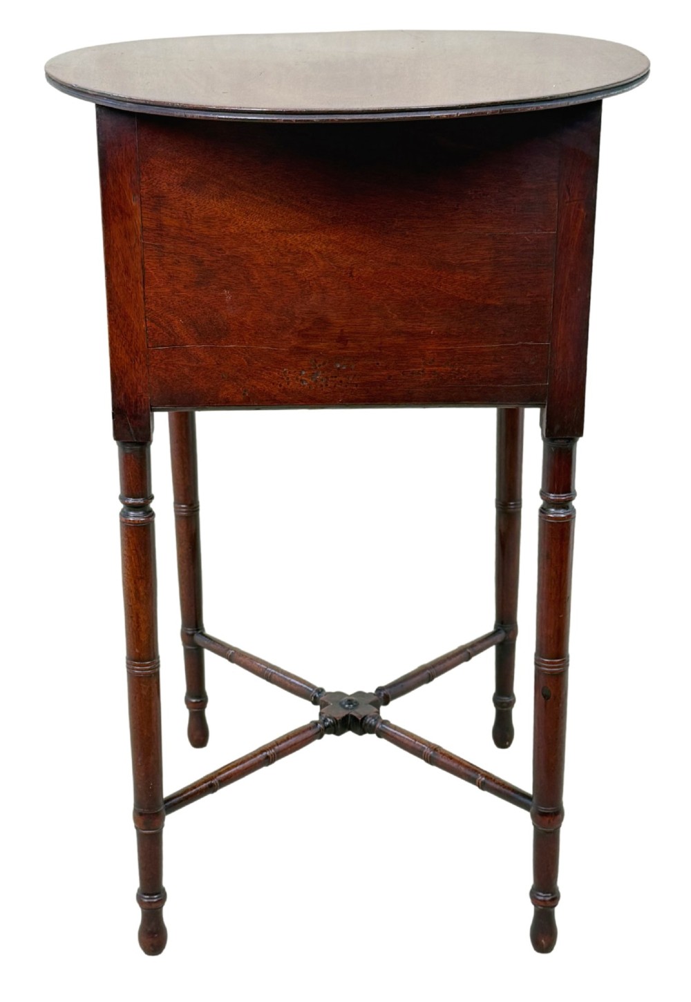 An early 19th-century Georgian mahogany side table featuring an oval top, single door cupboard with brass knob, turned legs, and an X-shaped cross stretcher. View III