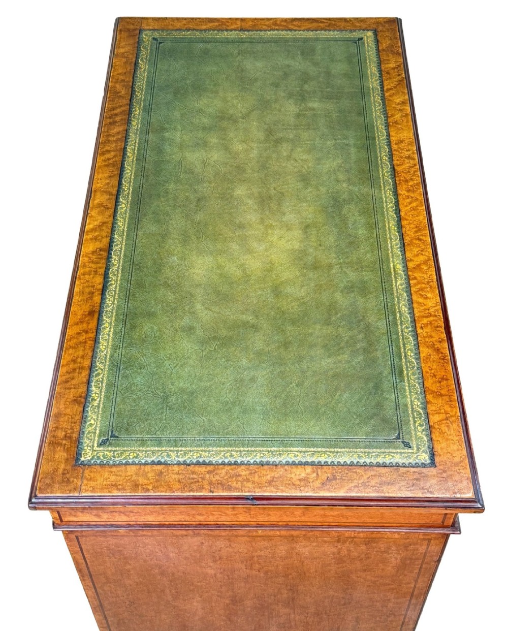 A mid-19th-century English birdseye maple pedestal desk featuring a green leather writing surface, multiple drawers with brass ring drop handles, and a plinth base. View V