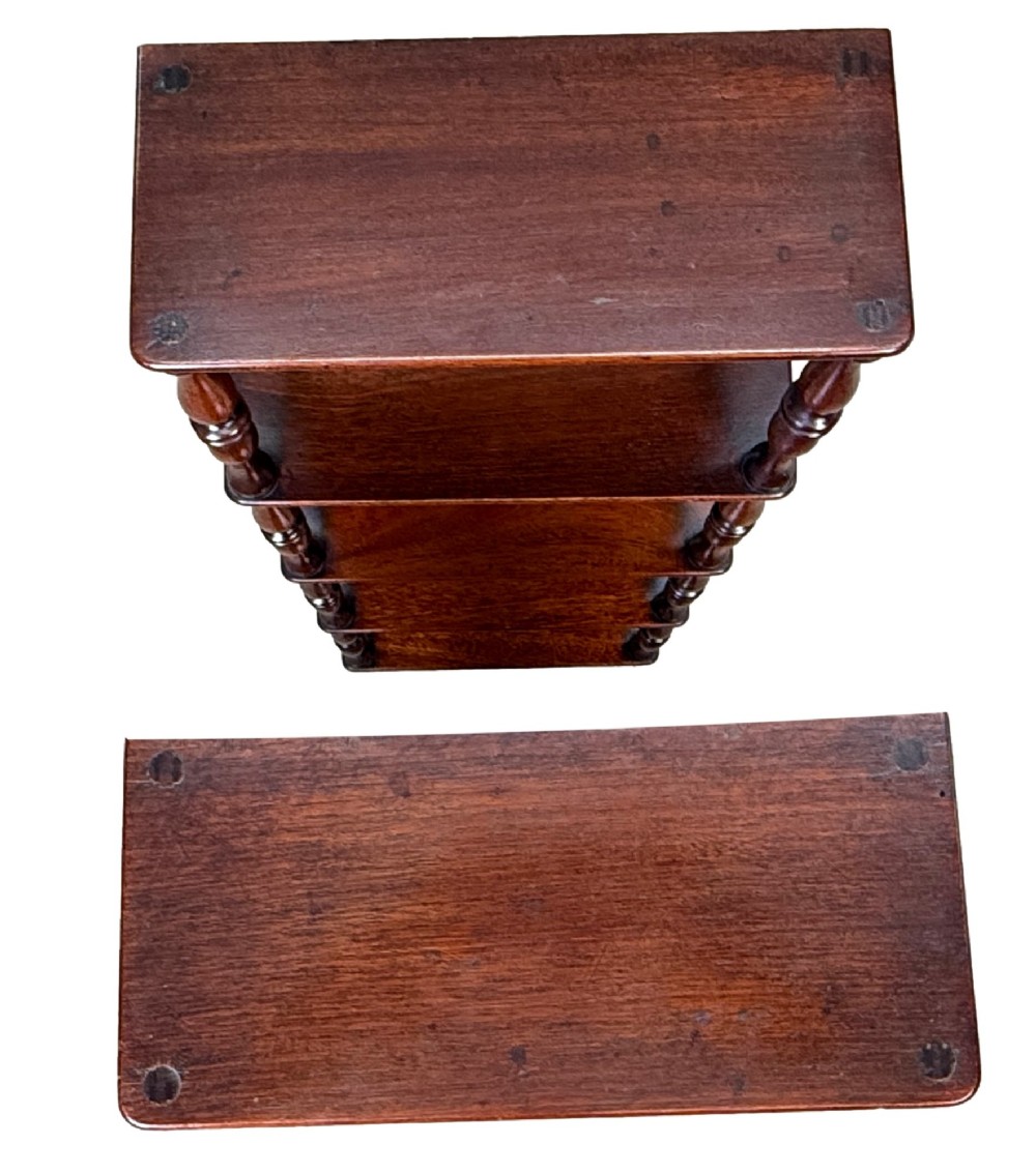 A pair of tall mid-19th-century mahogany wall-hanging shelves featuring five open tiers supported by turned spindles. View VII