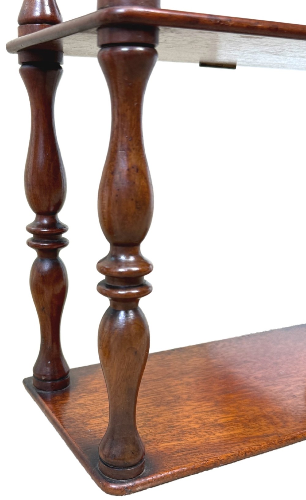 A pair of tall mid-19th-century mahogany wall-hanging shelves featuring five open tiers supported by turned spindles. View VIII