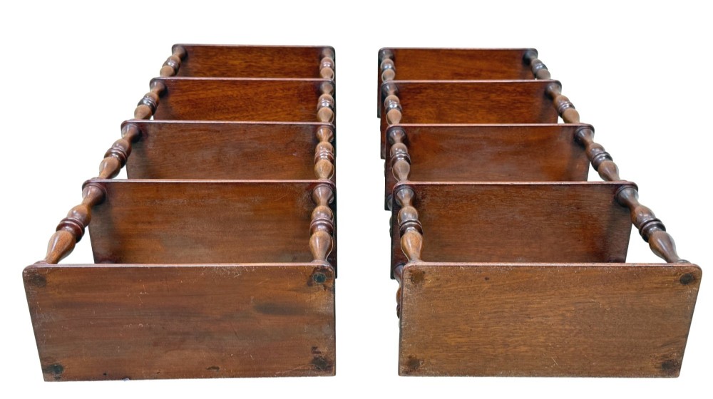 A pair of tall mid-19th-century mahogany wall-hanging shelves featuring five open tiers supported by turned spindles. View IX