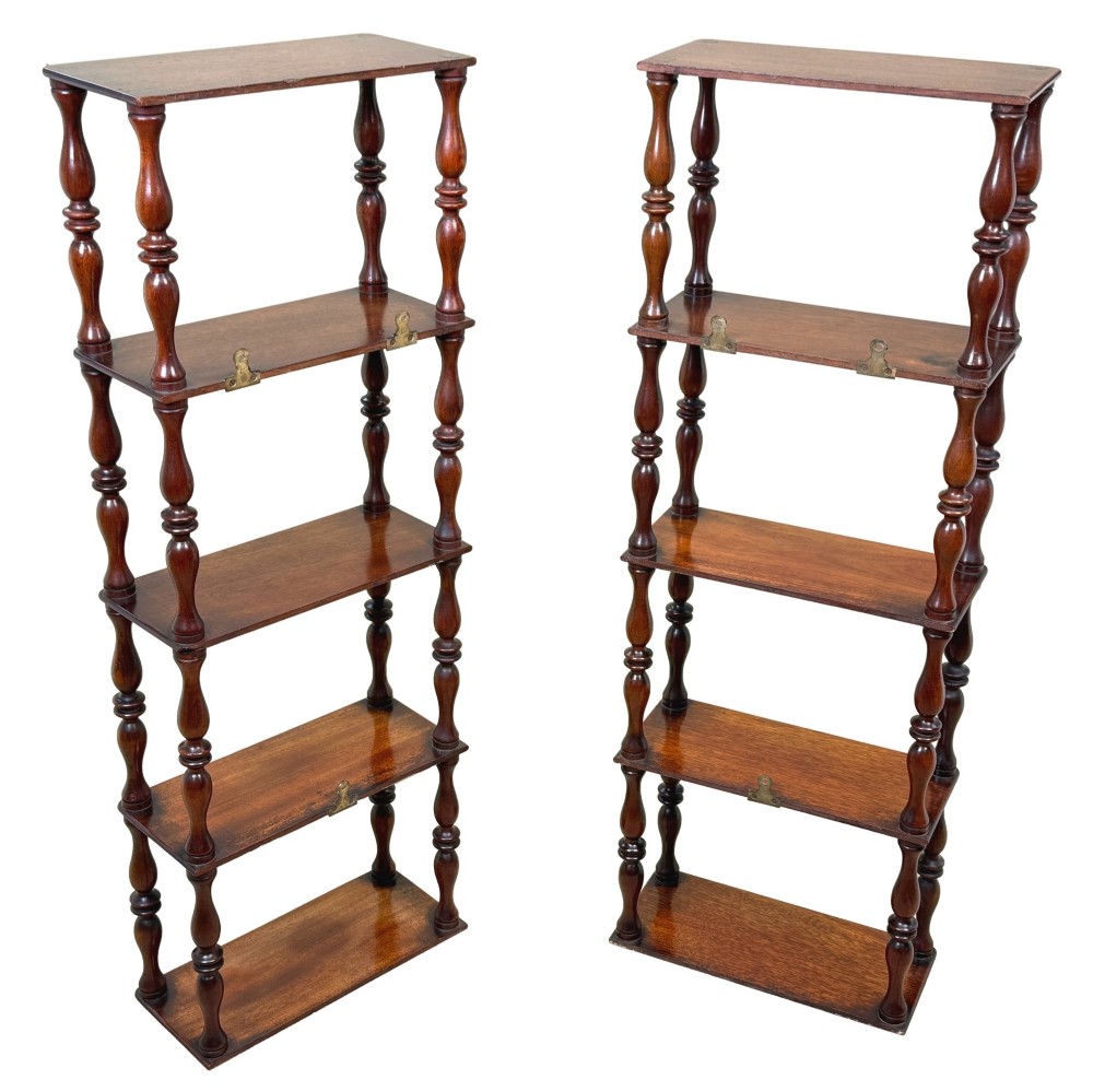 A pair of tall mid-19th-century mahogany wall-hanging shelves featuring five open tiers supported by turned spindles. View X